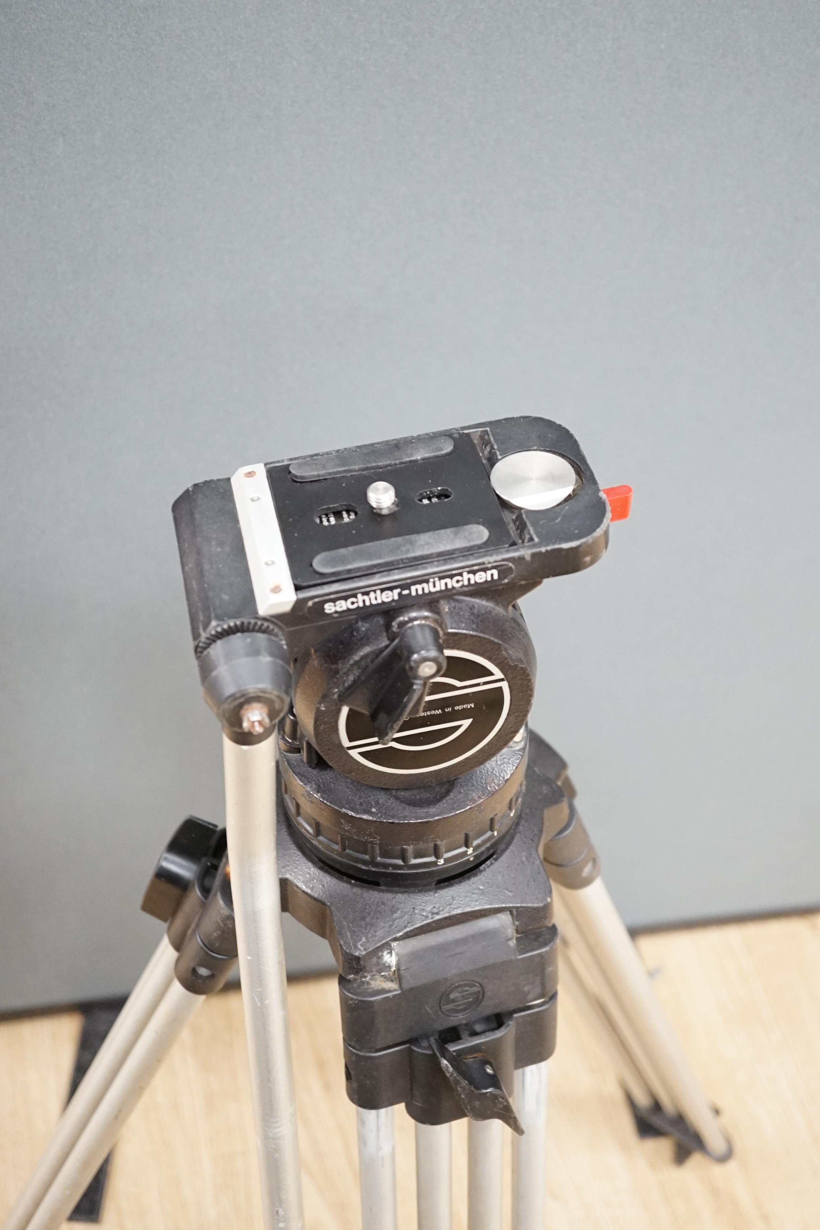 A Sachtler pro broadcast and cine camera, tripod and head, in plastic flight tube, 104cm high